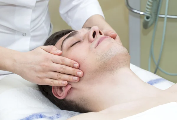 Man in the mask cosmetic procedure — Stock Photo, Image