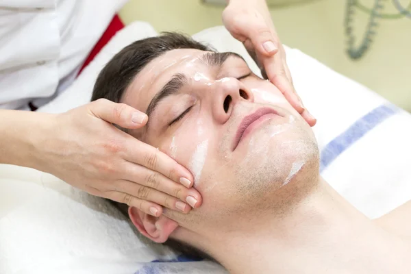 Man in the mask cosmetic procedure — Stock Photo, Image