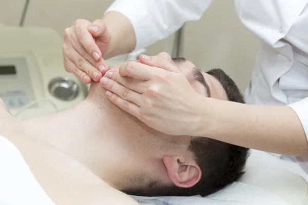 Man in the mask cosmetic procedure — Stock Photo, Image