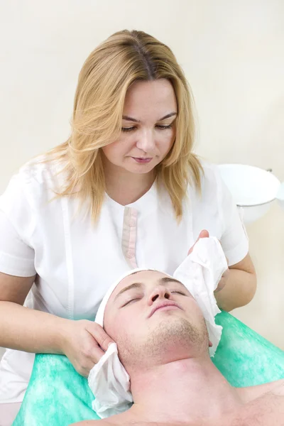 Man in the mask cosmetic procedure — Stock Photo, Image