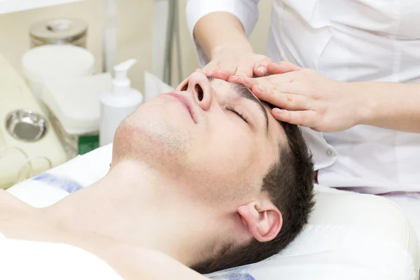 Man in the mask cosmetic procedure — Stock Photo, Image