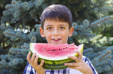 boy eating watermelon