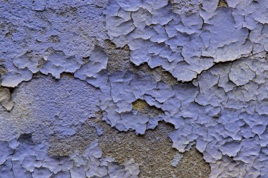 Eski duvarın soyut arkaplanı ve yakın plan boyalı.