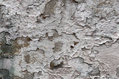 Eski duvarın soyut arkaplanı ve yakın plan boyalı.