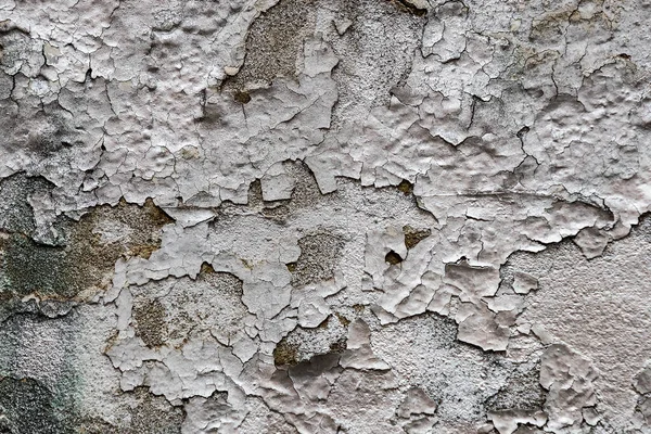 Eski duvarın soyut arkaplanı ve yakın plan boyalı.