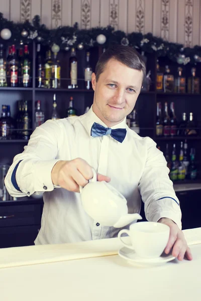 Young man working as a bartender — Stock Photo, Image