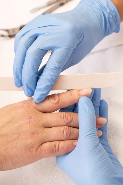 Processes work on a manicure — Stock Photo, Image