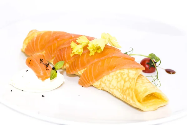 Scrambled eggs with cheese and salmon decorated with tomato — Stock Photo, Image