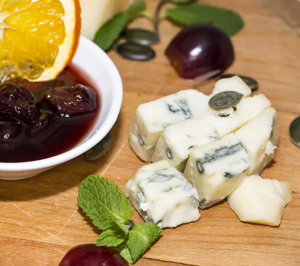 Plate of different kinds of cheese — Stock Photo, Image