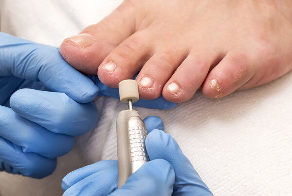 Process of pedicure at salon