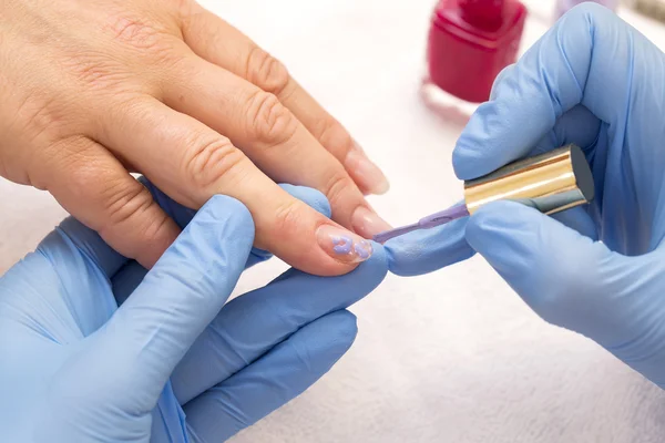 Processes work on a manicure — Stock Photo, Image