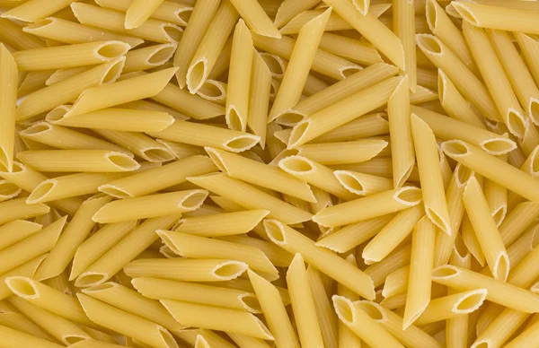 Penne pasta achtergrond — Stockfoto