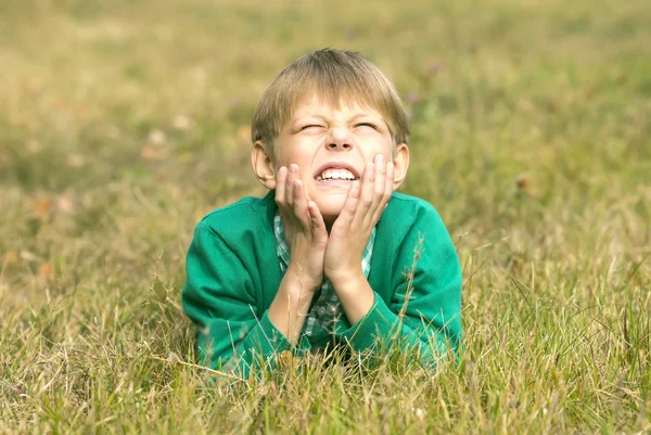 Boy on  background of green nature — Stock Photo, Image
