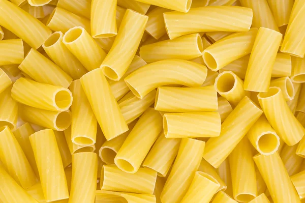 Tortiglioni pasta background — Stock Photo, Image