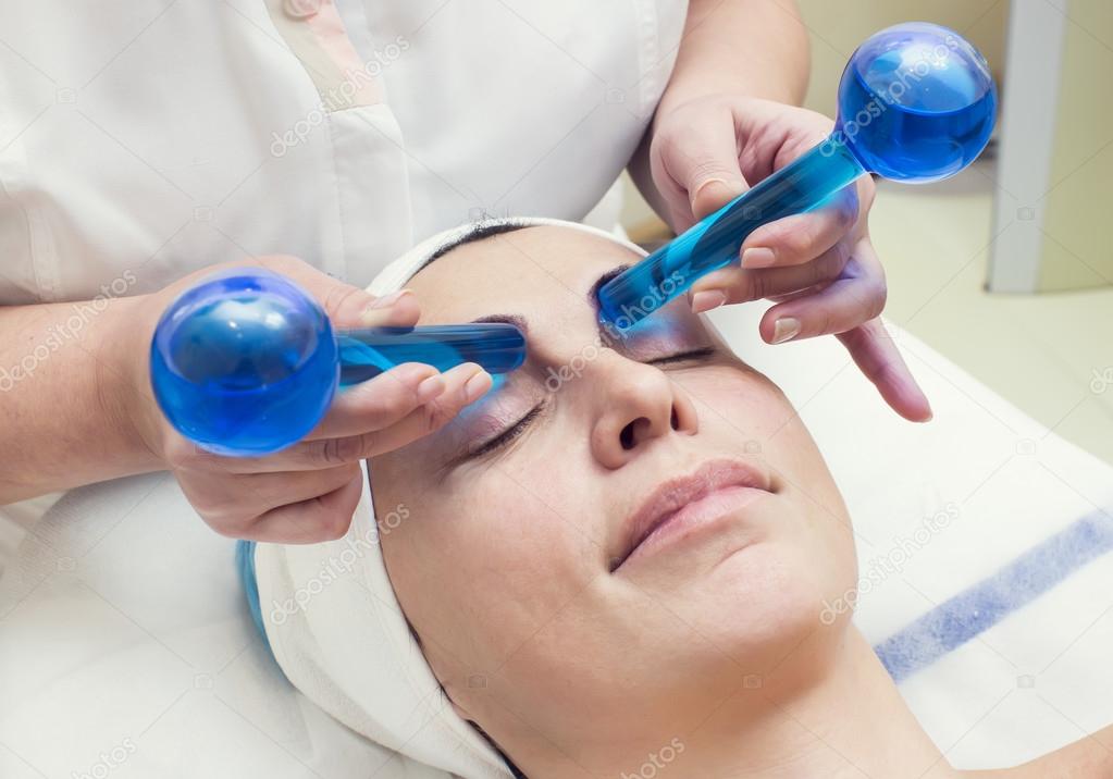 Woman on face massage procedure