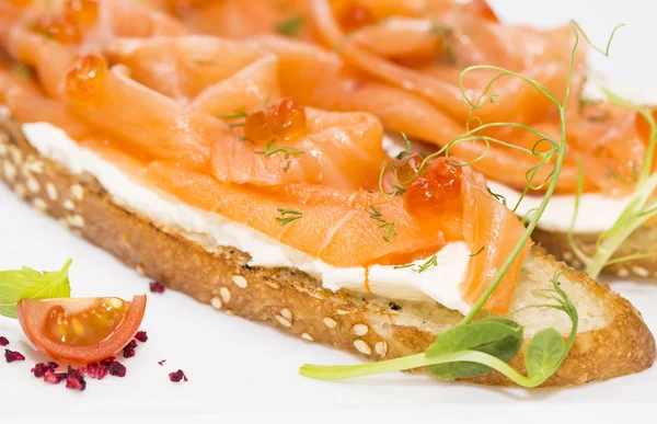 Sandwiches with salmon and caviar — Stock Photo, Image