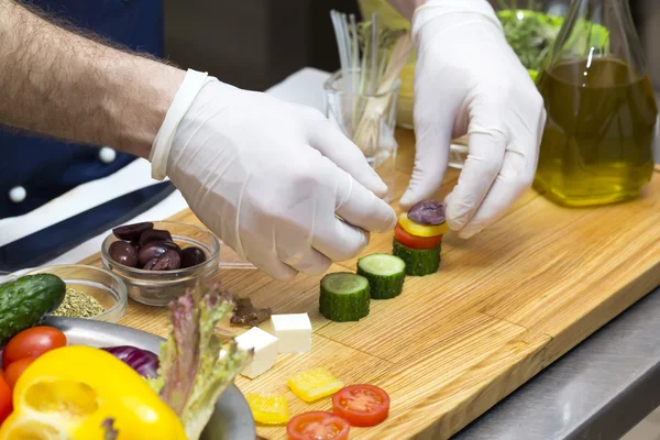 Cook preparing canapes — Stock Photo, Image