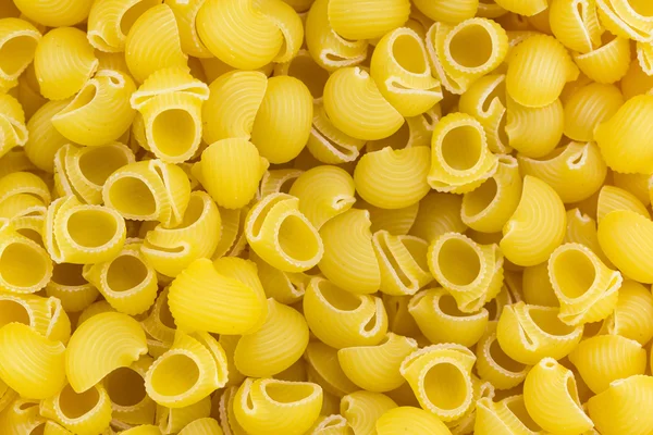 Rigate pasta bakgrund — Stockfoto