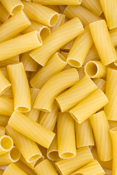 Tortiglioni pasta background — Stock Photo, Image