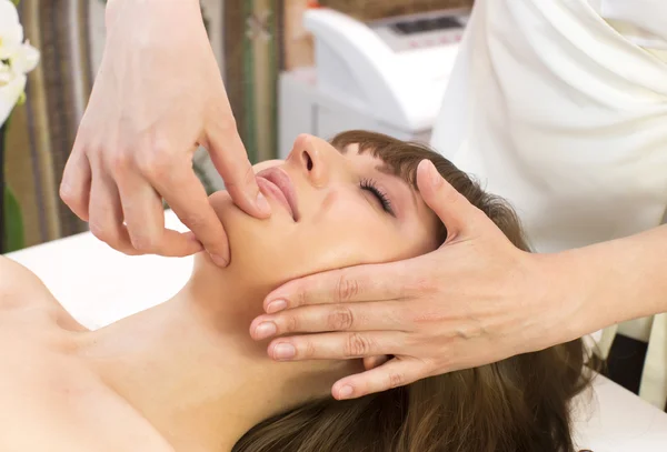 Woman on face massage procedure — Stock Photo, Image