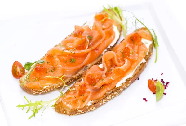 Sandwiches with salmon and caviar — Stock Photo, Image