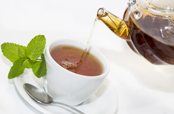 Tea poured from teapot — Stock Photo, Image