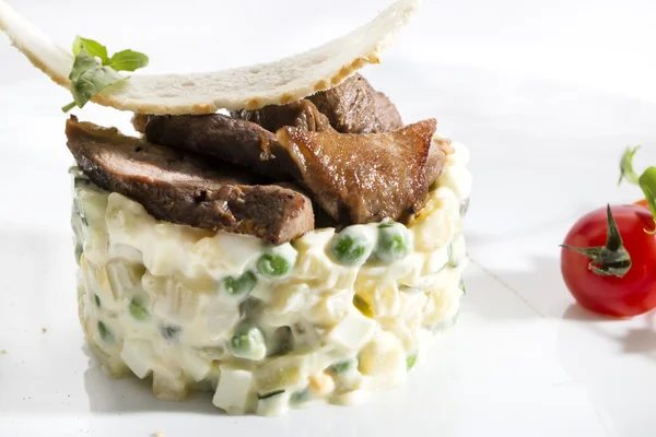 Salad with meat on plate — Stock Photo, Image