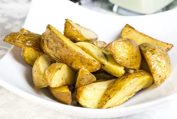 Fried potatoes in plate — Stock Photo, Image