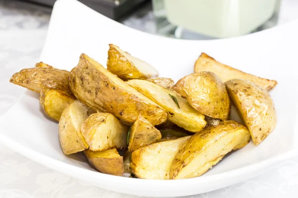 Fried potatoes on a plate — Stock Photo, Image