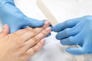 woman doing manicure close up