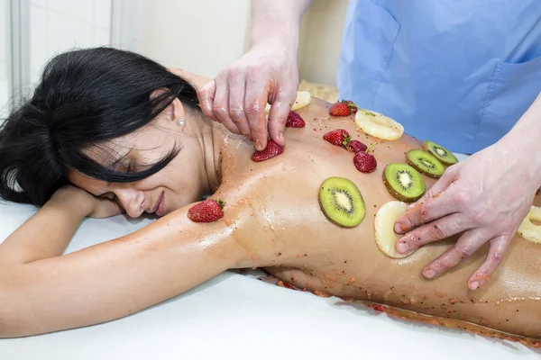 Woman getting fruit massage — Stock Photo, Image