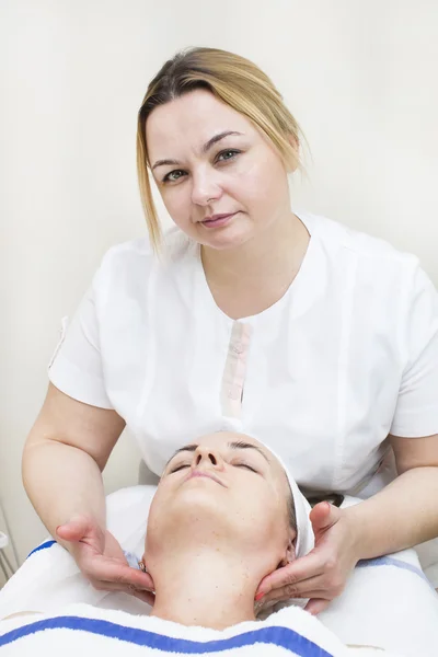 Massage and facial treatment — Stock Photo, Image