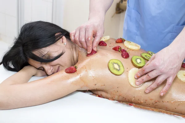 Woman getting fruit massage — Stock Photo, Image