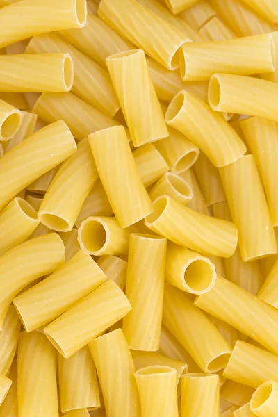 Tortiglioni pasta background — Stock Photo, Image