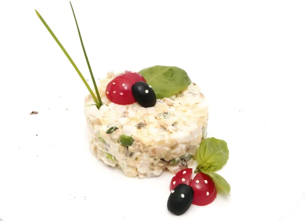 Olivier salad decorated with tomatoes — Stock Photo, Image