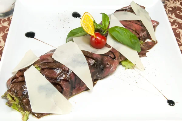 Beef carpaccio on a table — Stock Photo, Image