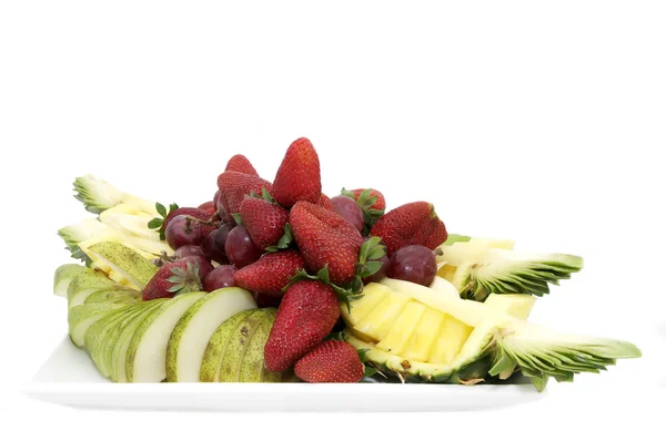 Large plate of sliced fruit — Stock Photo, Image