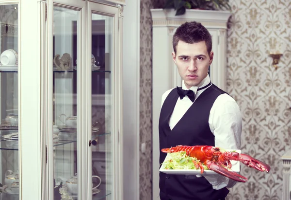 Waiter with a tray of food — Stock Photo, Image