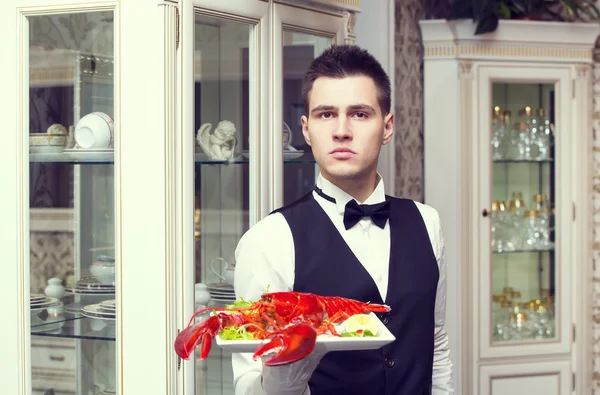 waiter with a tray of food