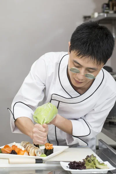 Japanese chef preparing a meal Stock Image