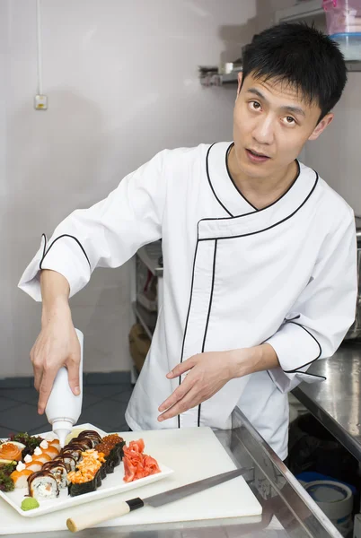 Japanese chef preparing a meal — Stock Photo, Image