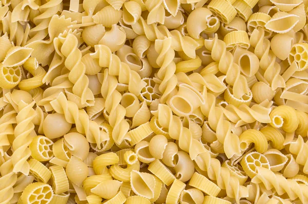 Bakgrund rå pasta — Stockfoto