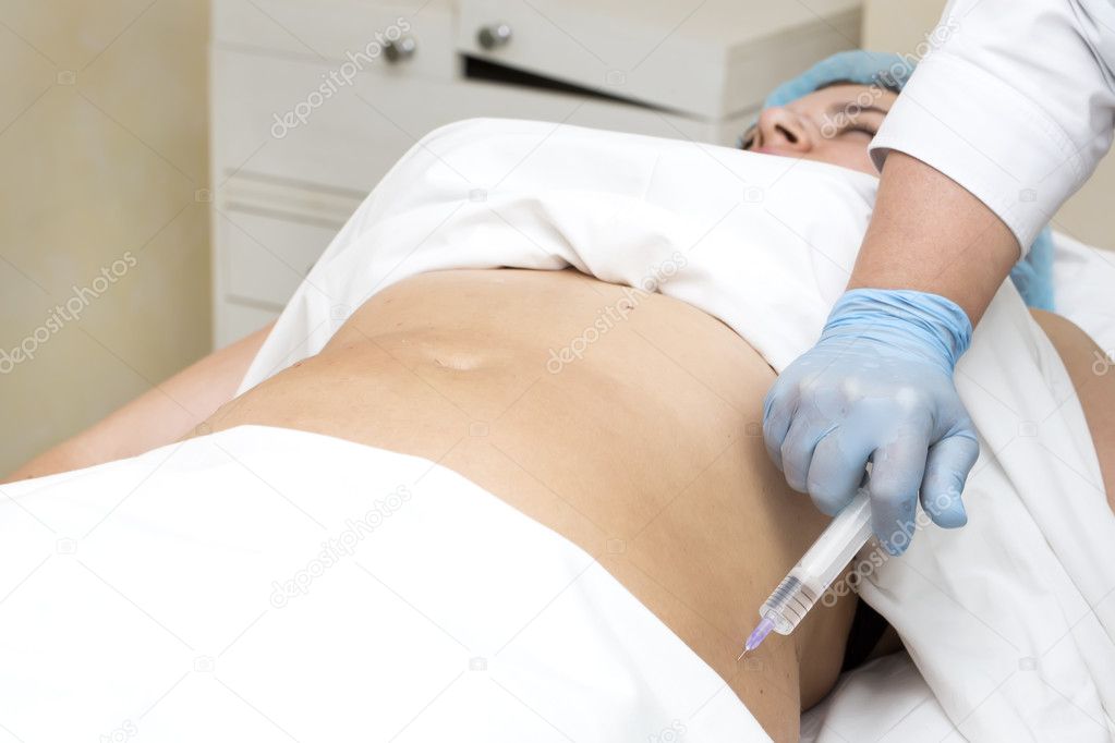 woman is in the process cellulite mesotherapy