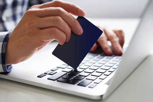 Man inserts the data for online payment — Stock Photo, Image