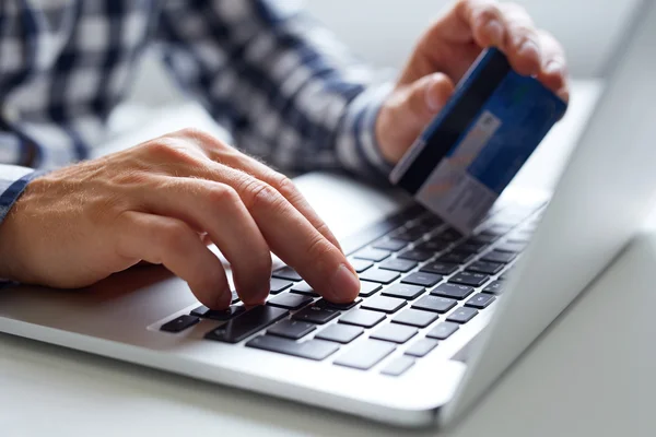 Man inserts data for online payments — Stock Photo, Image