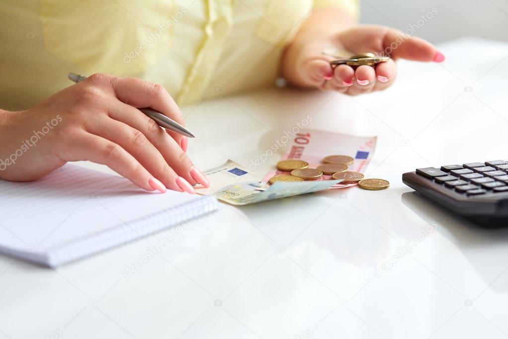 Woman with pen and money