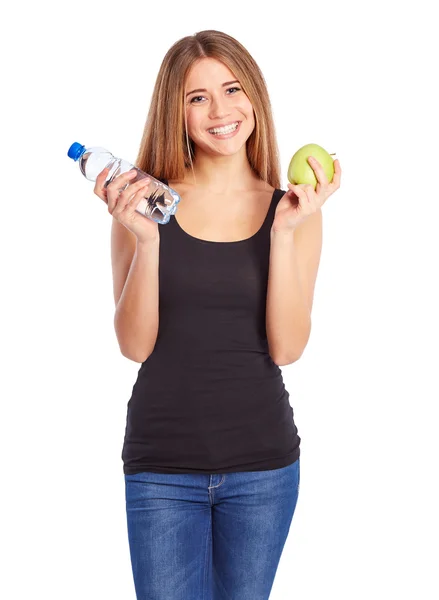 Jeune fille à la pomme verte et plein d'eau de bouteille pet — Photo