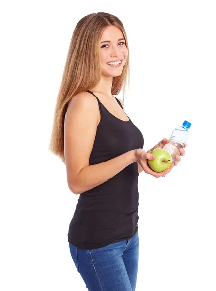 Niña con manzana verde y botellas pet llena de agua —  Fotos de Stock