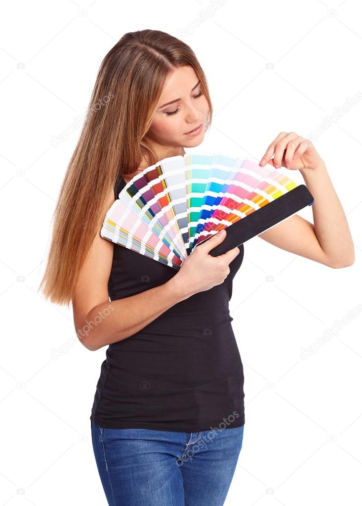 Young girl holding color swatch