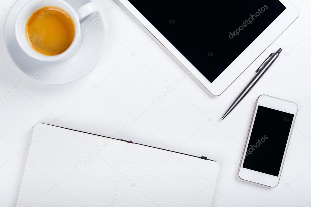 Top view of workplace on white table